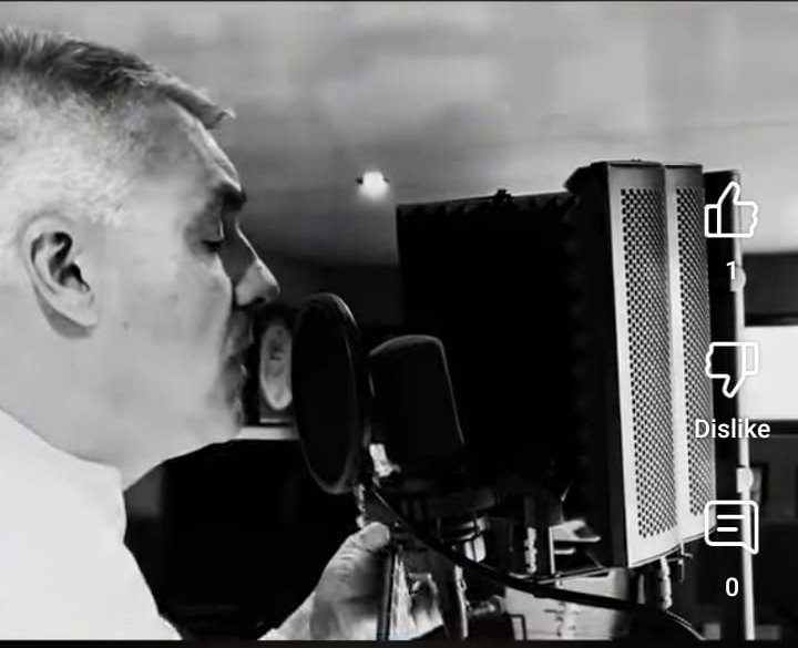 Pierre Netty singing at a studio microphone